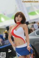 A woman in a red, white and blue outfit posing for a picture.