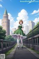 A girl in a green dress walking across a bridge.